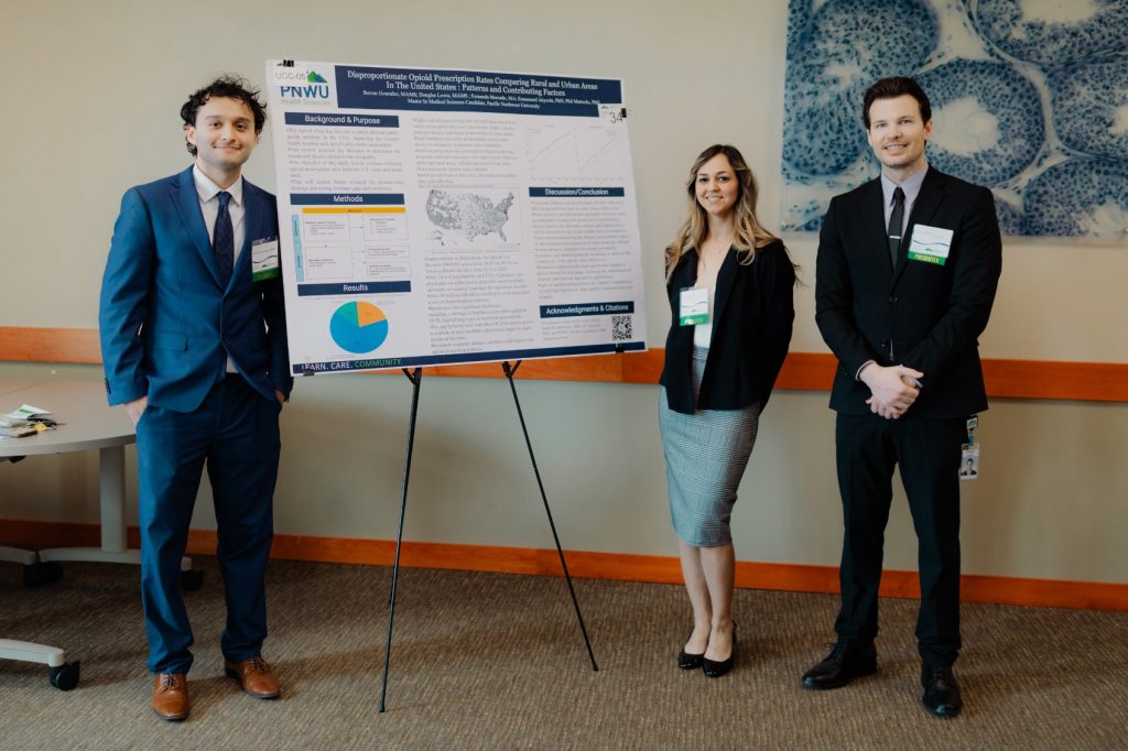 Students presenting posters at PNWU's 2024 Research Symposium